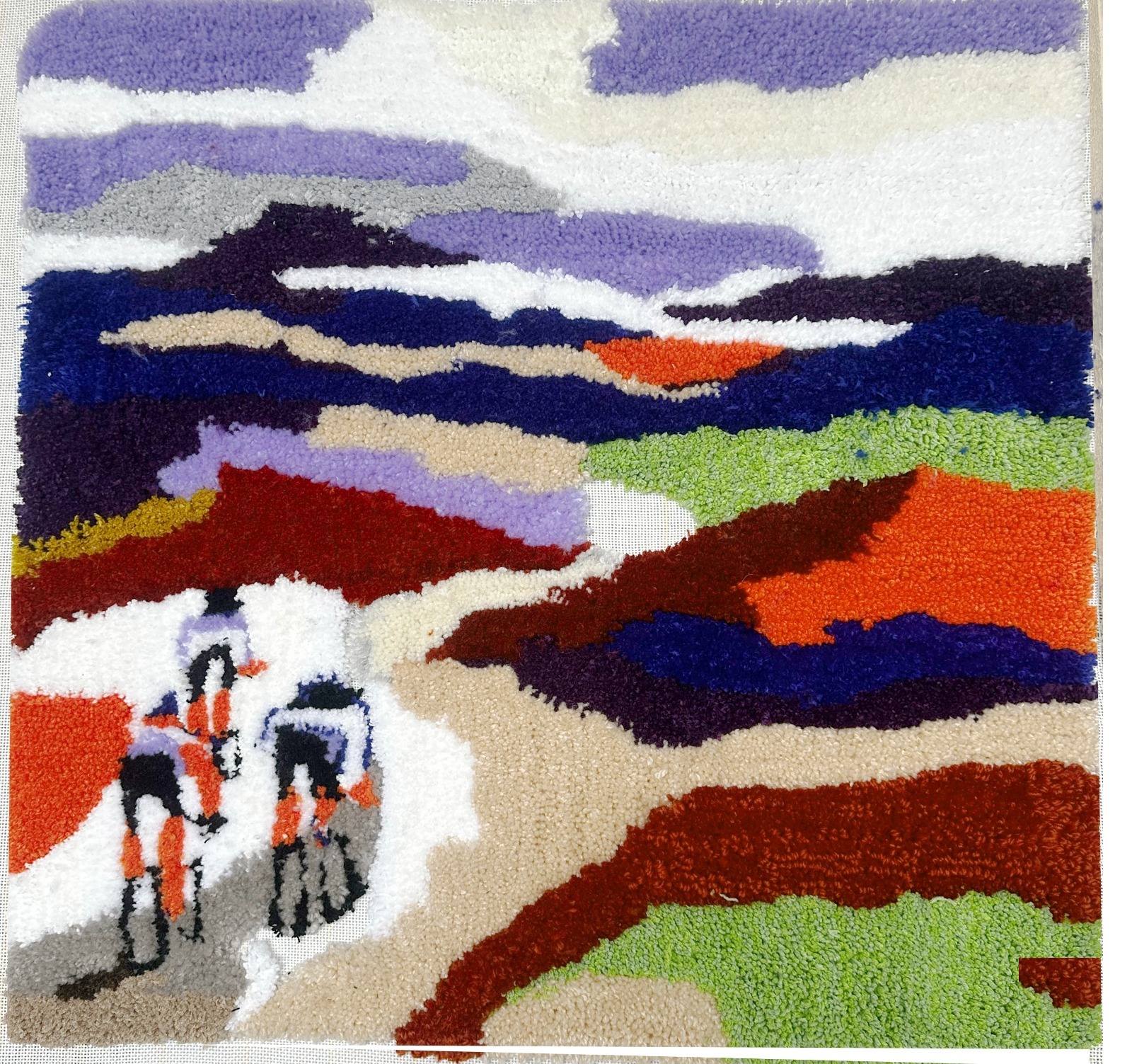 Peloton, hand-tufted landscape with cyclists, 2025.